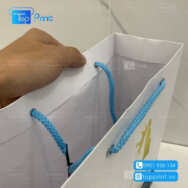 in ấn, cán màng, gắn dây cho túi giấy shop bán đồ